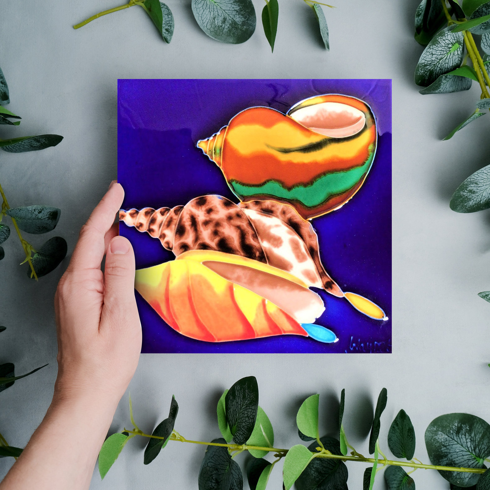 Continental Art Center 8x8" Three Snail Sea Shells with Blue Background